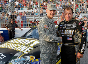 BG John Poppe, Assistant Surgeon General (Force Projection) and Chief, US Army Veterinary Corps, stands with Ryan Newman, driver of the Army Medicine #39 NASCAR. (Courtesy Photo) - Click to enlarge.