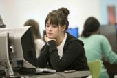 Girl looking at computer in lab