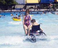 photo of individual entering a wave action pool