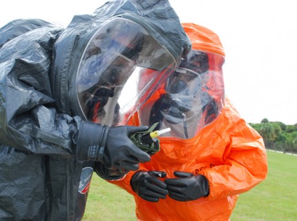 Members of the Florida National Guard's 44th Civil Support Team, the Brevard County Fire Rescue and Airmen from Patrick Air Force Base particpate in the Level A Olympics, an interagency coordination training event for HAZMAT technicians, in Cocoa Beach, Fla., Sept. 12, 2012. Photo by Sgt. Michael Baltz