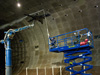 Cal Poly research students control the smoke visualization wand in the blowing winds and darkness of the National Full-Scale Aerodynamic Complex wind tunnel.