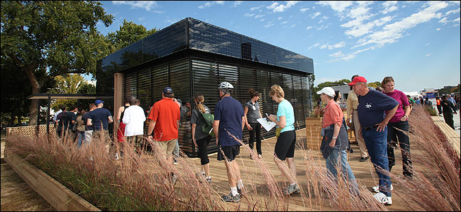 Photo of people walking around a new home.