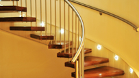 Photo of lights illuminating a stairwell.