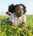 girl playing in field
