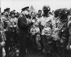 Photo, Gen Dwight D 
		  Eisenhower gives the order of the Day. "Full victory - nothing else" to paratroopers in England, 6 June 1944.