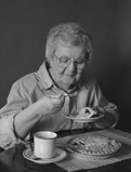 Photo of woman eating - Click to enlarge in new window.