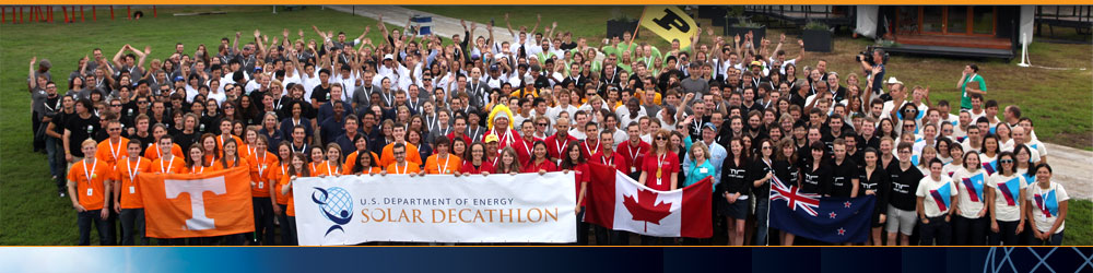 Photo of the Solar Decathlon 2011 student teams. The front row holds a banner with the U.S. Department of Energy Solar Decathlon logo.