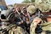 U.S. service members assigned to Provincial Reconstruction Team Farah conduct interviews with villagers during a civil affairs mission in Dizak village in Afghanistan's Farah province, Sept. 12, 2012. U.S. Navy photo by Lt. Benjamin Addison