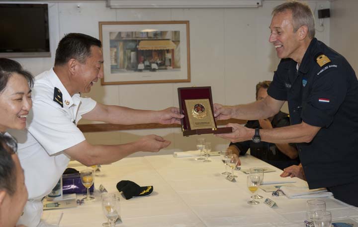 Rear Admiral Zhou Xuming presents a shield to Cdre Ben Bekkering