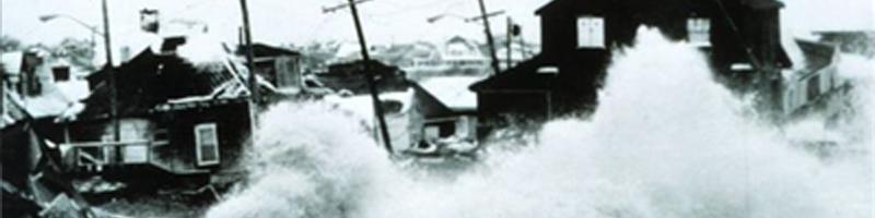 February 6th, 1978. Waves crash into coastal homes due to the blizzard's winds.