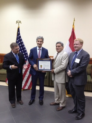 Cameron Kerry presenting certificate of appreciation to Ali Qaragholi