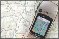 Photo of Garmin GPS sitting on a map