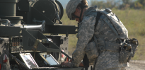 Female soldier repairing