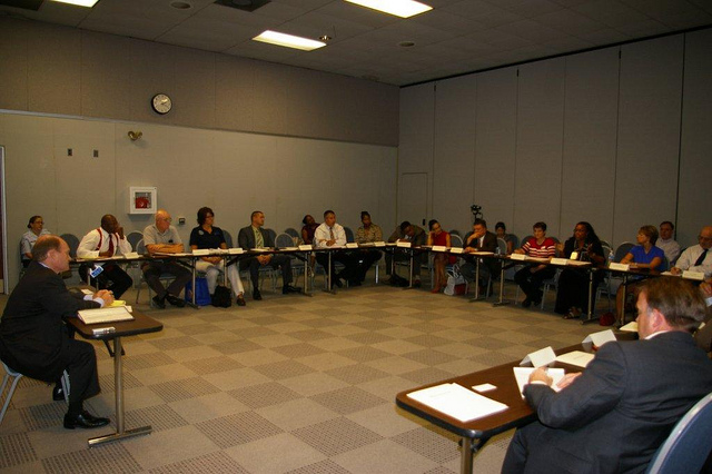 Senator Coons leading a roundtable discussion. 