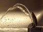 Photo of a water coming out of a water fountain.