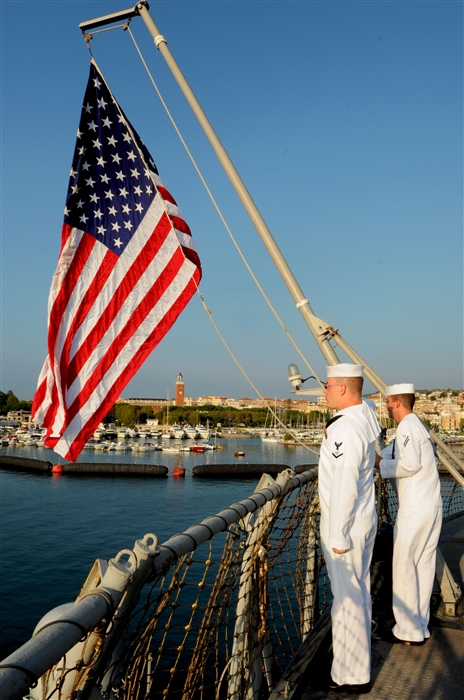 GAETA, Italy - Information Systems
Technician 3rd Class Derek Pitre, left, and Operations Specialist Seaman Apprentice Douglas Mellon, right, raise the national ensign during morning colors on the flightdeck of USS Mount Whitney (LCC 20).  The crew aboard Mount Whitney and embarked U.S. 6th Fleet staff attended morning colors as
part of a ceremony to remember those who lost their lives during the
terrorist attacks on Sept. 11, 2001. Mount Whitney, homeported in Gaeta, Italy, is the U.S. 6th Fleet flagship and operates with a combined crew of U.S. Sailors and MSC civil service mariners. The civil service mariners perform navigation, deck, engineering, laundry and galley service operations while military personnel aboard support communications, weapons systems and security.