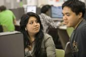 Girl and boy working at computer