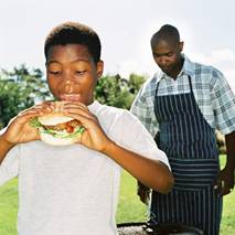 Boy eating a hamburger.jpg