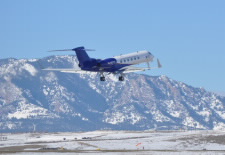 Image of research plane with mountains in the background. Click for larger image.