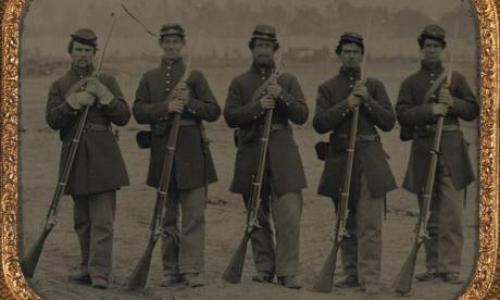 Five Civil War soldiers in Union uniforms with muskets