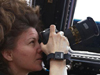 Astronaut Cady Coleman with camera in Cupola