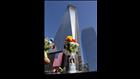 A candle with flowers sits on the 9/11 memorial during memorial ceremonies for the 
eleventh anniversary of the terrorist attacks on lower 

Manhattan at the World Trade Center site September 11, 2012 in New York City. (Photo by David Karp-Pool/Getty Images) 