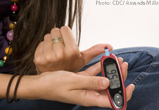 A diabetic teen testing her blood glucose level
