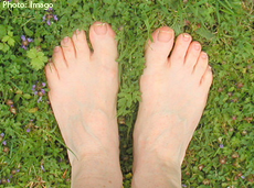 A photo of feet in the grass