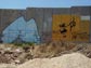 A drawing of Mahatma Gandhi on the wall separating the West Bank from Israel.