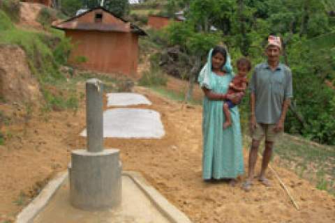 This family in Kaski, a mountainous region of central Nepal, benefited from a USAID program installing multi-use water systems. 