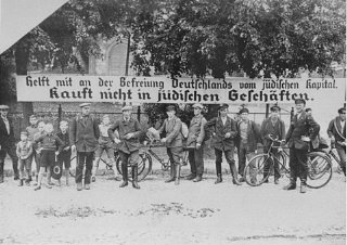 Sign used during the anti-Jewish boycott: "Help liberate Germany from Jewish capital. Don't buy in Jewish stores." Germany, 1933.