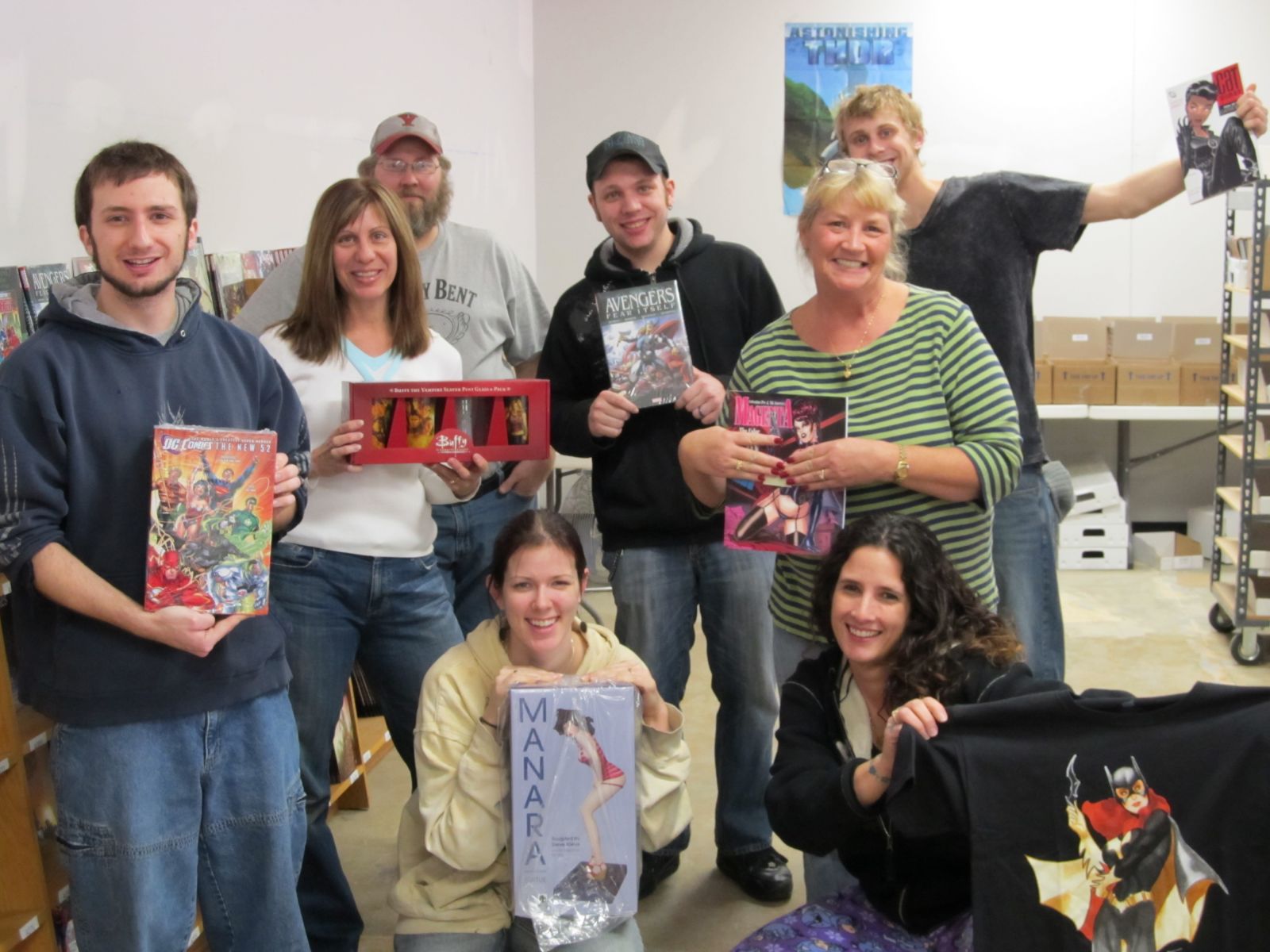 Mitch Meyer and the crew at Mail Order Comics in Gretna pose with some of their wares.