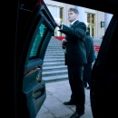 A U.S. Secret Service agent waits by the spare limousine