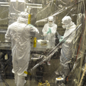 Scientists prepare to store the EUV radiometer after its extraction from the vacuum chamber. 