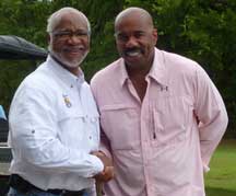 Dr. Tuggle and Steve Harvey at the Steve Harvey Mentoring Weekend