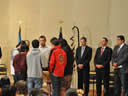 From left – Standing Rock High School Drum Group performs 'Honoring Song' as Deputy Attorney General Cole, U.S. Attorney Tim Purdon and Assistant U.S. Attorney Gary Delorme look on.