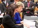 European Union Principal Vice-President and Commissioner for Justice Viviane Reding and EU Commissioner for Home Affairs Cecilia Malmström look over meeting materials.