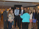 Attorney General Holder chatting informally with attendees of the Pro Bono Institute awards dinner.