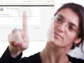 Photo of a woman touching her finger in the center of a circle on the NSF Digital Strategy web page.