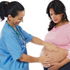 Photo of nurse touching a pregnant woman's stomach.