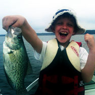 Child holding up a fish