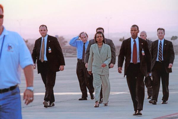 July 2006:  DS special agents escort U.S. Secretary of State Condoleezza Rice at the airport in Larnica, Cyprus. The Secretary transits Cyprus on her way to Lebanon, during the evacuation of Americans in Beirut. (Source: U.S. Embassy Cyprus)