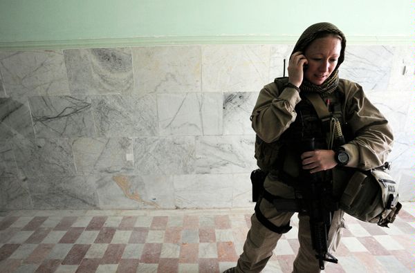 November 1, 2010:  While leading a protective detail for U.S. Ambassador to Afghanistan Karl Eikenberry during his first trip to Kandahar University, a Diplomatic Security special agent checks in with the Task Force Raider Operations Center at nearby Camp Nathan Smith. (Source: U.S. Embassy Kabul Photographer Daniel Wilkinson)