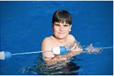 Young boy in swimming pool