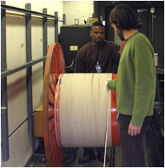 A 1 km fiber optic length standard under calibration.