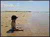 picture of a baby on a beach