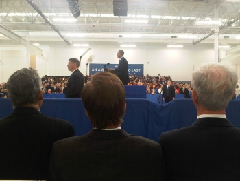 From the front row, Secretary Bryson watches President Obama at the Rolls-Royce Crosspointe Manufacturing Plant