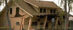 A house cracked and broken from earthquake damage