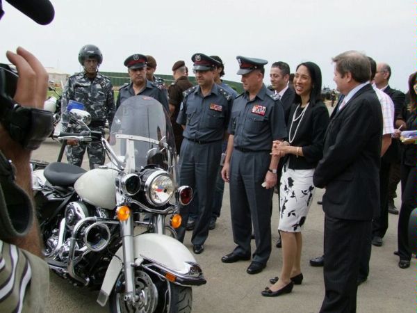 U.S. Ambassador to Lebanon Michele J. Sison (second from right) inspects a new Harley Davidson police motorcycle with Lebanese Internal Security Forces commanders. 