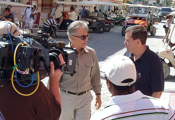 John Walsh (rear center), host of the television program America's Most Wanted (AMW), interviews Regional Security Officer Rob Kelty (rear right) in San Pedro, Belize February 12,  2010 about U.S. fugitive apprehensions in Belize. The interview was broadcast on February 27, 2010.